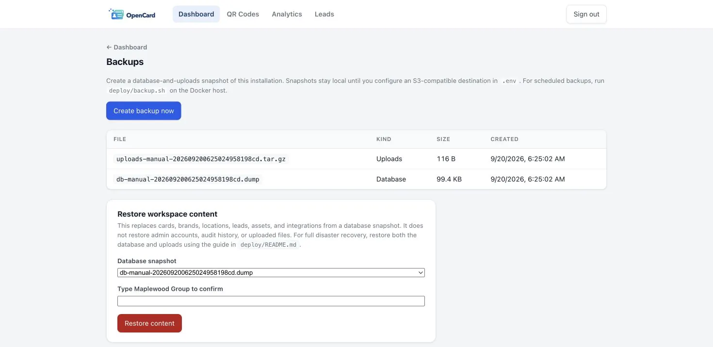 Backups page listing database and upload snapshots with workspace restore controls